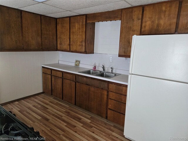 8991 Lakeview Dr, White Lake, MI 48386 - kitchen featuring freestanding refrigerator, light countertops, and wood finished floors