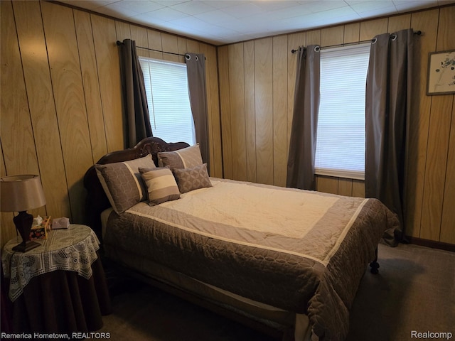 8991 Lakeview Dr, White Lake, MI 48386 - bedroom featuring carpet floors, wooden walls, and multiple windows