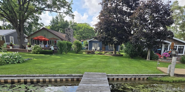 8991 Lakeview Dr, White Lake, MI 48386 - view of grassy yard with a deck with water view