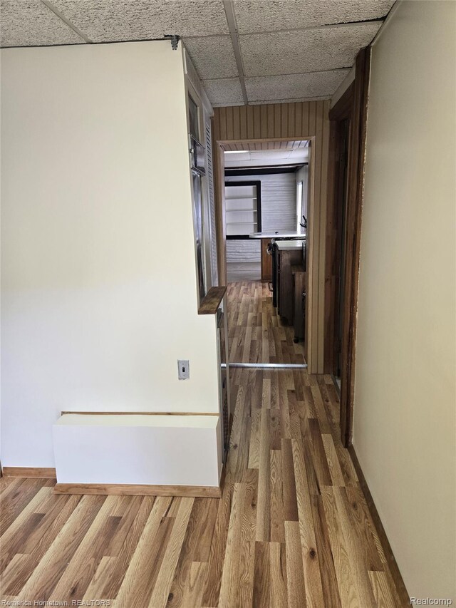 8991 Lakeview Dr, White Lake, MI 48386 - hallway with dark wood-type flooring and baseboards