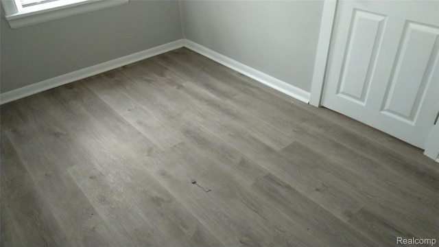22100 Hawthorne St, Rochester, MI 48336 - detailed view of wood finished floors and baseboards