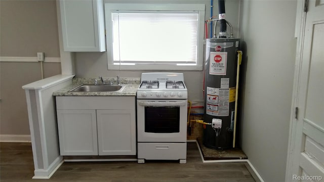 22100 Hawthorne St, Rochester, MI 48336 - kitchen featuring white gas range, water heater, wood finished floors, light countertops, and white cabinetry