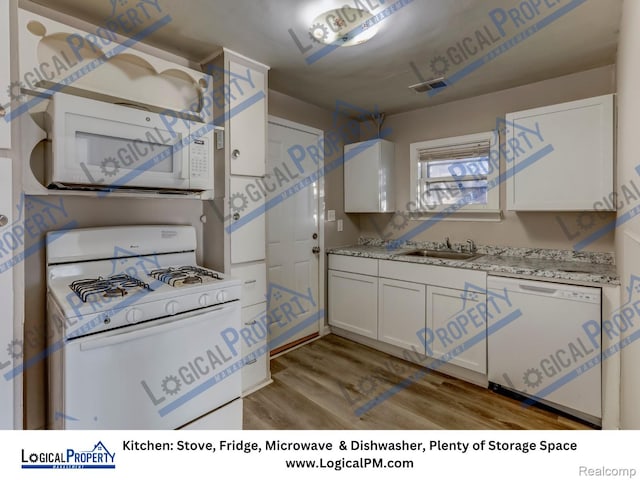 22100 Hawthorne St, Rochester, MI 48336 - kitchen featuring white appliances, light wood-type flooring, and white cabinetry