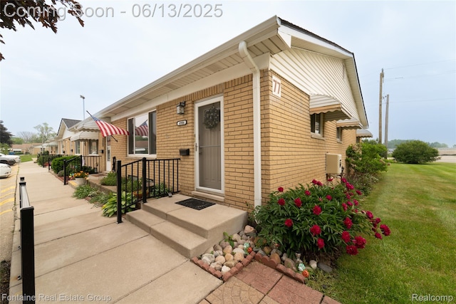 49904 Helfer Blvd, Wixom, MI 48393 - view of front of home featuring brick siding and a front yard