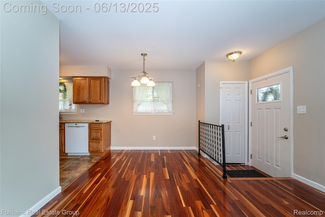 49904 Helfer Blvd, Wixom, MI 48393 - foyer featuring dark wood-type flooring and a chandelier
