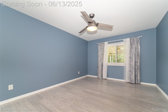 49904 Helfer Blvd, Wixom, MI 48393 - spare room with wood finished floors and ceiling fan