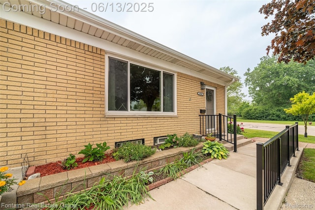 49904 Helfer Blvd, Wixom, MI 48393 - property entrance with brick siding