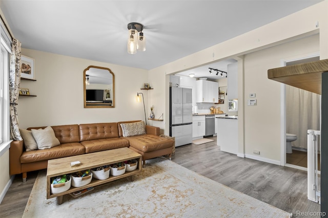 23083 Tawas Ave, Hazel Park, MI 48030 - living room featuring wood finished floors and baseboards