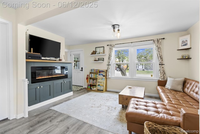 23083 Tawas Ave, Hazel Park, MI 48030 - living room with a glass covered fireplace and wood finished floors