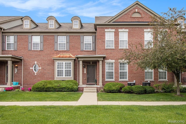 49761 Courtyard Ln, Canton, MI 48188 - view of front of home featuring a front lawn and brick siding
