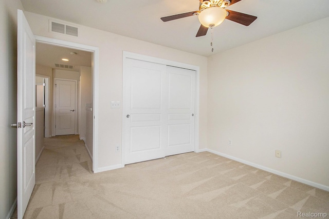 49761 Courtyard Ln, Canton, MI 48188 - unfurnished bedroom featuring light carpet, a closet, and a ceiling fan
