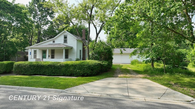 107 E Johns St, Durand, MI 48429 - view of front of house with a chimney and a front yard