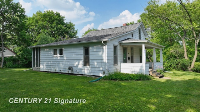107 E Johns St, Durand, MI 48429 - view of property exterior with covered porch, a yard, a chimney, and a shingled roof