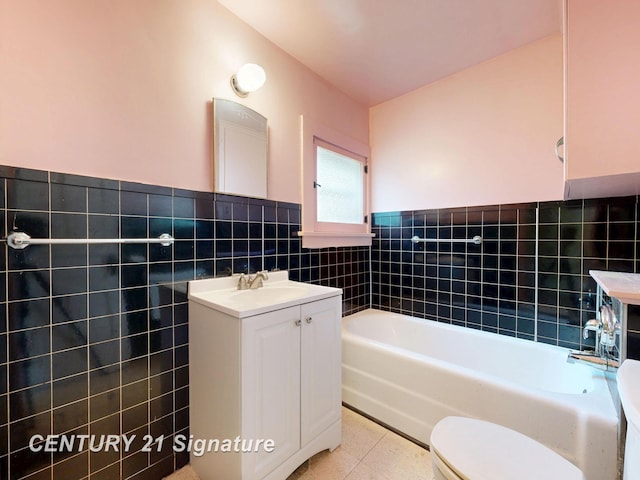 107 E Johns St, Durand, MI 48429 - full bath featuring tile walls, vanity, tile patterned flooring, a garden tub, and wainscoting