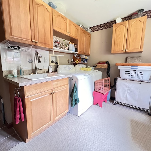 7484 Cedar Lake Rd, Oscoda, MI 48750 - washroom featuring cabinet space and independent washer and dryer