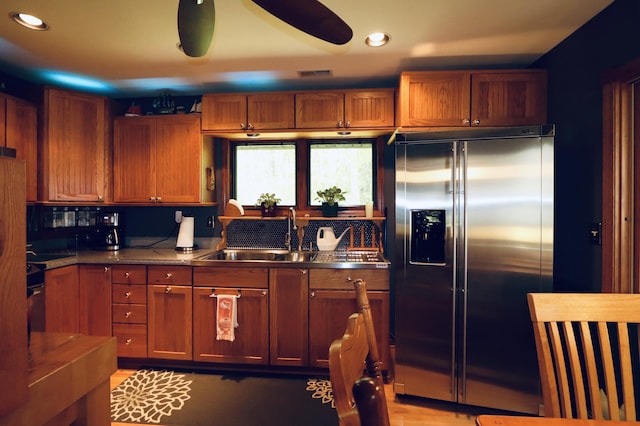 7484 Cedar Lake Rd, Oscoda, MI 48750 - kitchen featuring high quality fridge, a sink, brown cabinetry, and recessed lighting