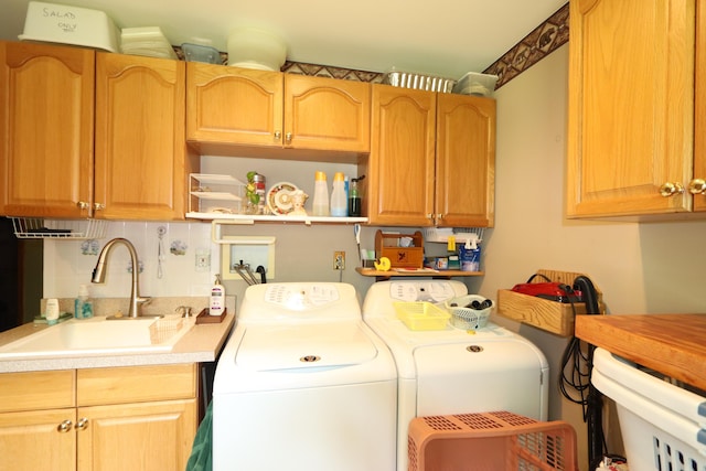 7484 Cedar Lake Rd, Oscoda, MI 48750 - washroom featuring independent washer and dryer and cabinet space