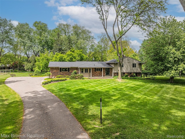 26480 Scenic Hwy, Franklin, MI 48025 - tri-level home with brick siding, a front lawn, and driveway