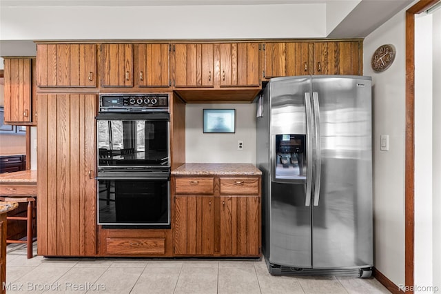 26480 Scenic Hwy, Franklin, MI 48025 - kitchen featuring stainless steel fridge with ice dispenser, brown cabinetry, light tile patterned floors, and baseboards