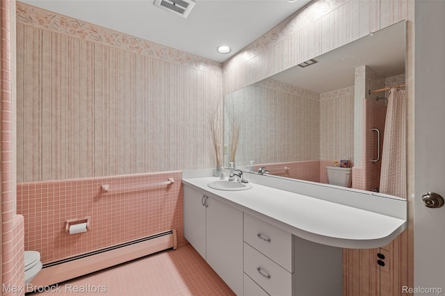 26480 Scenic Hwy, Franklin, MI 48025 - bathroom featuring wallpapered walls, a baseboard radiator, toilet, vanity, and wainscoting
