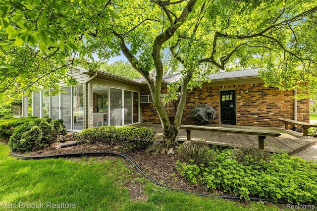 26480 Scenic Hwy, Franklin, MI 48025 - back of house with a sunroom, brick siding, and a deck