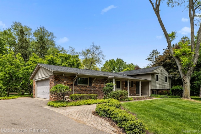 26480 Scenic Hwy, Franklin, MI 48025 - split level home featuring brick siding, asphalt driveway, a front lawn, a garage, and a chimney