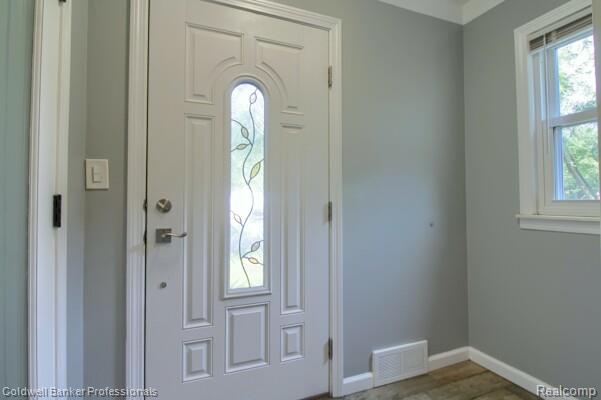 25811 Briarbank Ave, Southfield, MI 48033 - foyer entrance with baseboards and wood finished floors