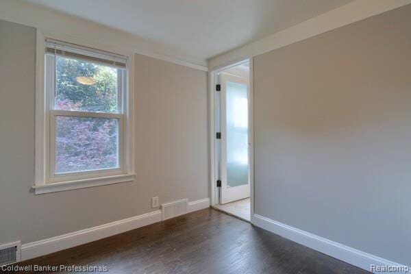 25811 Briarbank Ave, Southfield, MI 48033 - unfurnished room with baseboards and wood finished floors