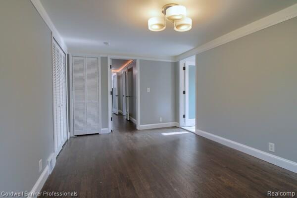 25811 Briarbank Ave, Southfield, MI 48033 - unfurnished room featuring wood finished floors, baseboards, and ornamental molding