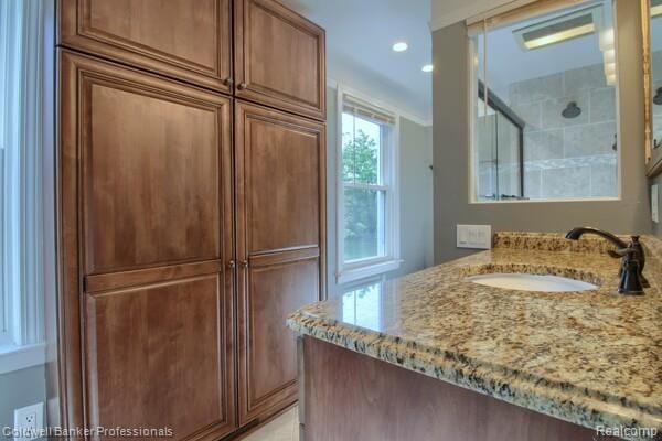 25811 Briarbank Ave, Southfield, MI 48033 - full bath with vanity, recessed lighting, and a shower