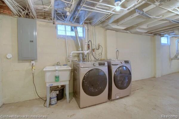 25811 Briarbank Ave, Southfield, MI 48033 - laundry area featuring electric panel, washer and dryer, and healthy amount of natural light