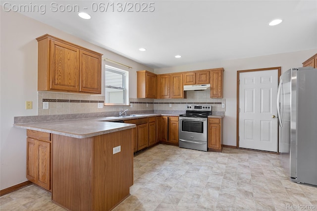 12172 Rynn Rd, Emmett, MI 48022 - kitchen featuring stainless steel appliances, under cabinet range hood, a peninsula, tasteful backsplash, and a sink