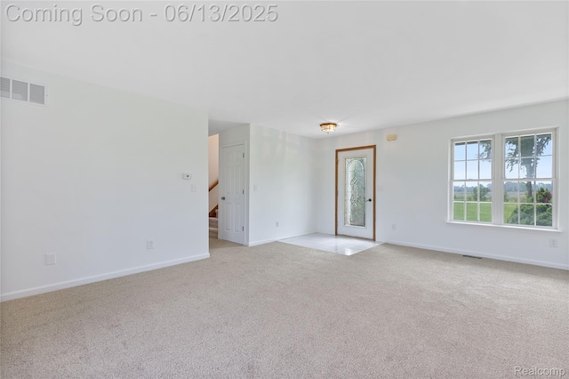 12172 Rynn Rd, Emmett, MI 48022 - carpeted empty room featuring baseboards and stairway
