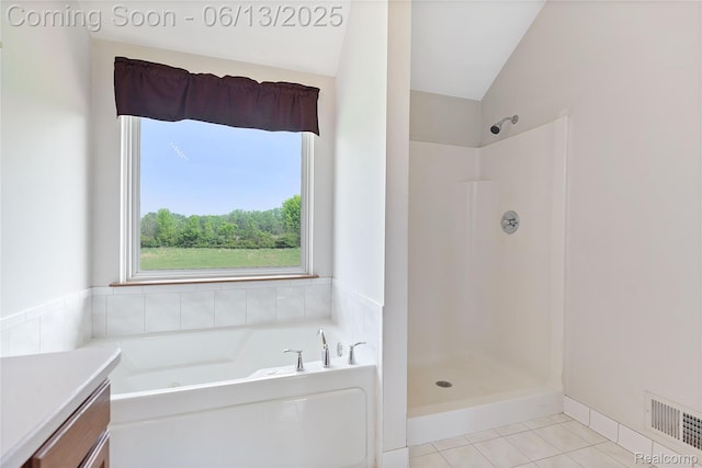 12172 Rynn Rd, Emmett, MI 48022 - bathroom with a bath, tile patterned flooring, lofted ceiling, vanity, and a shower