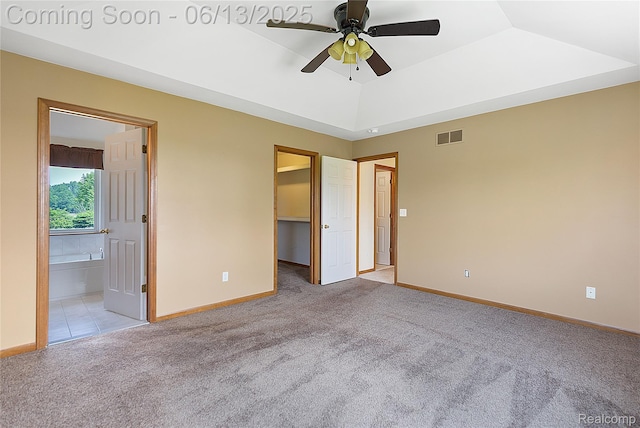 12172 Rynn Rd, Emmett, MI 48022 - unfurnished bedroom featuring light colored carpet, a walk in closet, and baseboards