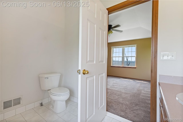 12172 Rynn Rd, Emmett, MI 48022 - half bath featuring toilet, vanity, a ceiling fan, tile patterned floors, and lofted ceiling