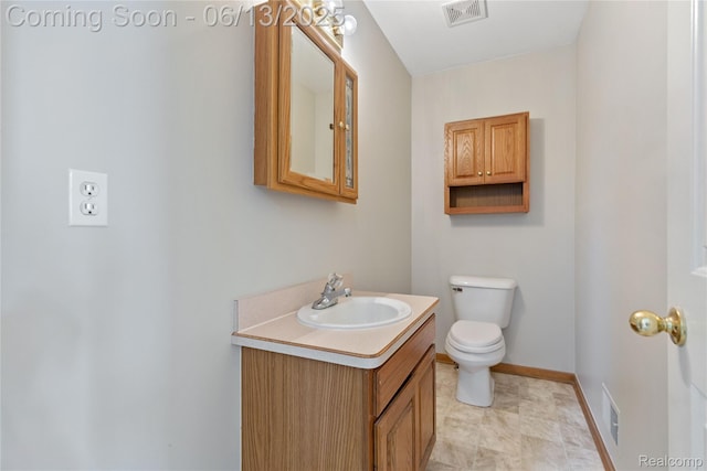 12172 Rynn Rd, Emmett, MI 48022 - bathroom with vanity, toilet, and baseboards