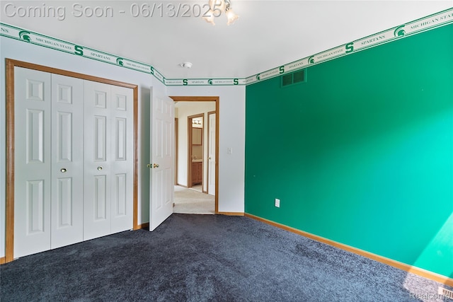 12172 Rynn Rd, Emmett, MI 48022 - unfurnished bedroom with dark colored carpet, a closet, and baseboards