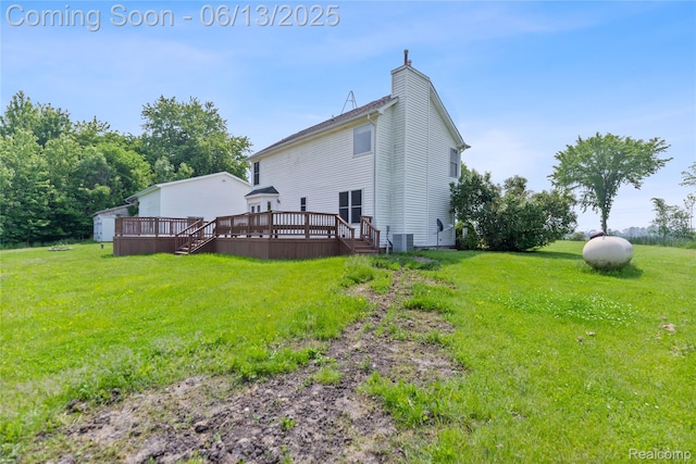 12172 Rynn Rd, Emmett, MI 48022 - back of property with a deck, a chimney, a yard, and central air condition unit