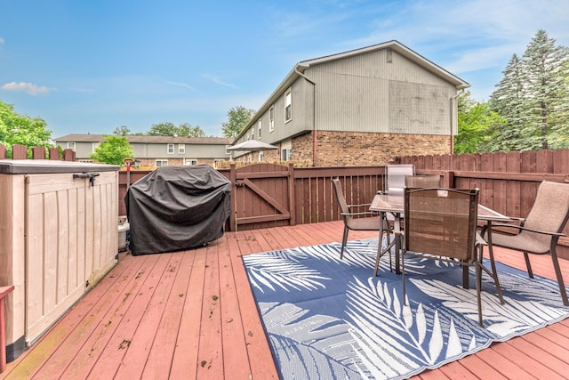 386 Hartman Ln, Saline, MI 48176 - deck featuring a gate, outdoor dining space, and grilling area