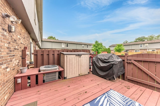 386 Hartman Ln, Saline, MI 48176 - wooden terrace featuring grilling area and a residential view