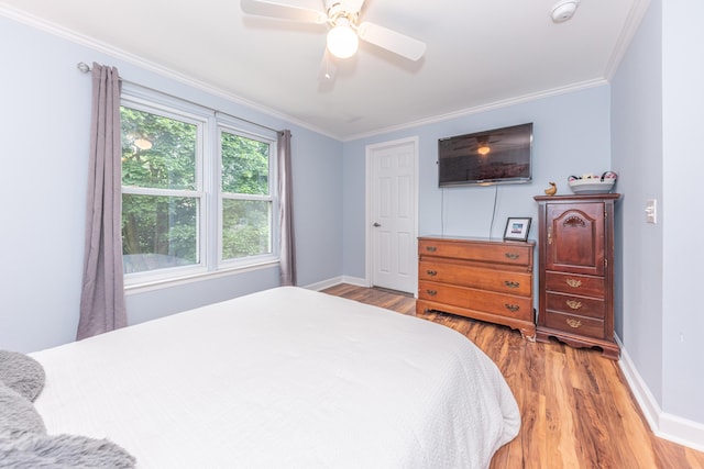 386 Hartman Ln, Saline, MI 48176 - bedroom featuring wood finished floors, baseboards, ornamental molding, and a ceiling fan