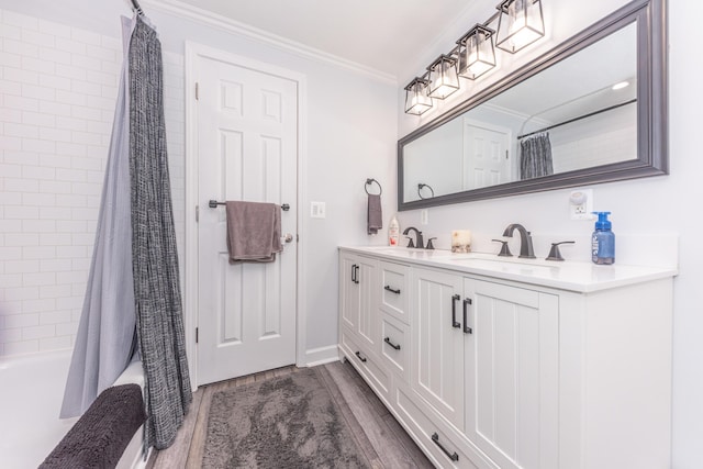 386 Hartman Ln, Saline, MI 48176 - bathroom with wood finished floors, double vanity, shower / bath combination with curtain, crown molding, and baseboards