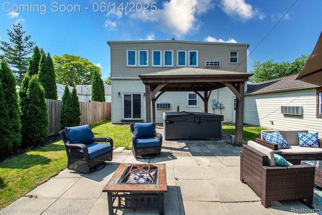 7359 Mckinley, Center Line, MI 48015 - fenced backyard featuring a hot tub, a gazebo, an outdoor living space with a fire pit, and a patio area