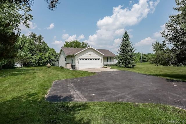 7448 Avoca Rd, Clyde, MI 48049 - view of front of property featuring driveway, a garage, and a front lawn