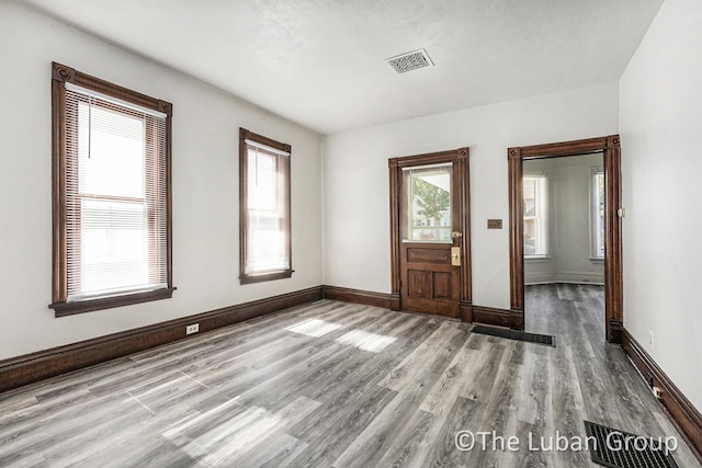 630 Prospect Ave NE, Grand Rapids, MI 49503 - foyer entrance featuring wood finished floors and baseboards