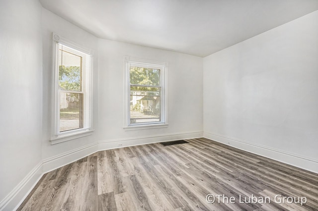 630 Prospect Ave NE, Grand Rapids, MI 49503 - empty room with wood finished floors and baseboards