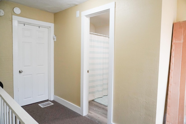 121 Houseman Ave NE, Grand Rapids, MI 49503 - hall with baseboards and dark wood-type flooring