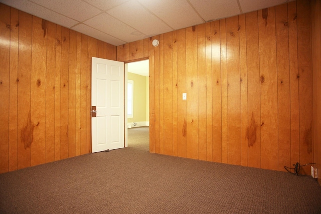 121 Houseman Ave NE, Grand Rapids, MI 49503 - empty room featuring carpet floors and wood walls