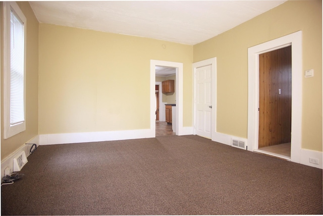121 Houseman Ave NE, Grand Rapids, MI 49503 - unfurnished room featuring carpet and baseboards